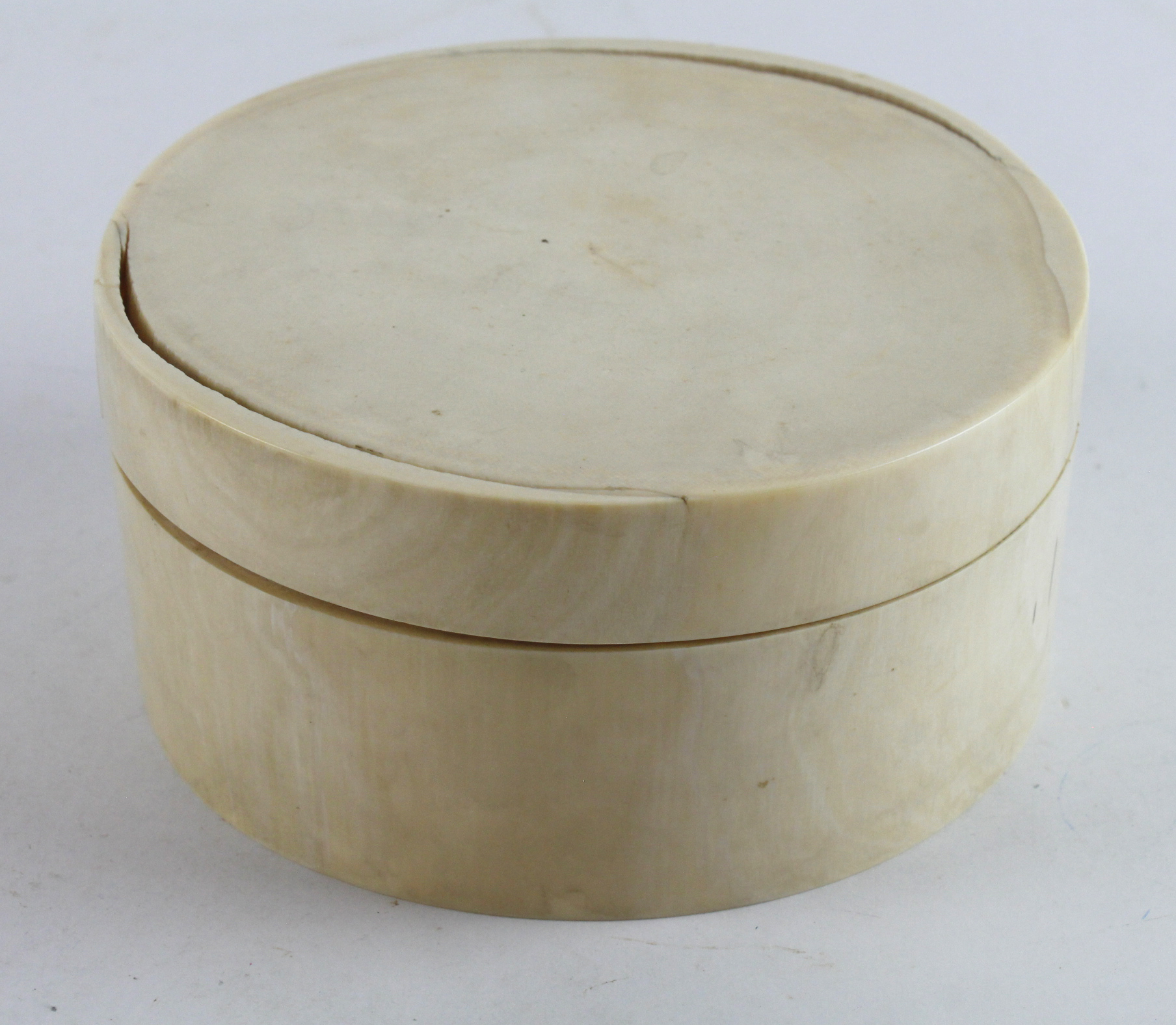 Fossilised Mammoth tusk trinket box, contemporary Victorian label to base, some cracks, height