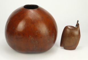 Carved bird (Zimbabwe) along with a decorative polished natural gourde