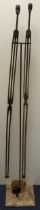 Pair of S.African hand-carved, elongated male and female figurines. Hung on a purpose made stand.