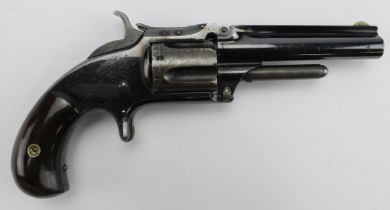 Smith and Wesson "Tip up" pocket pistol, barrel 9cm, Calibre .32 rimfire. Rosewood "birds head"