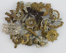 Cap Badges: A good group of 20 different cap badges, mixed periods with no apparent restrikes.