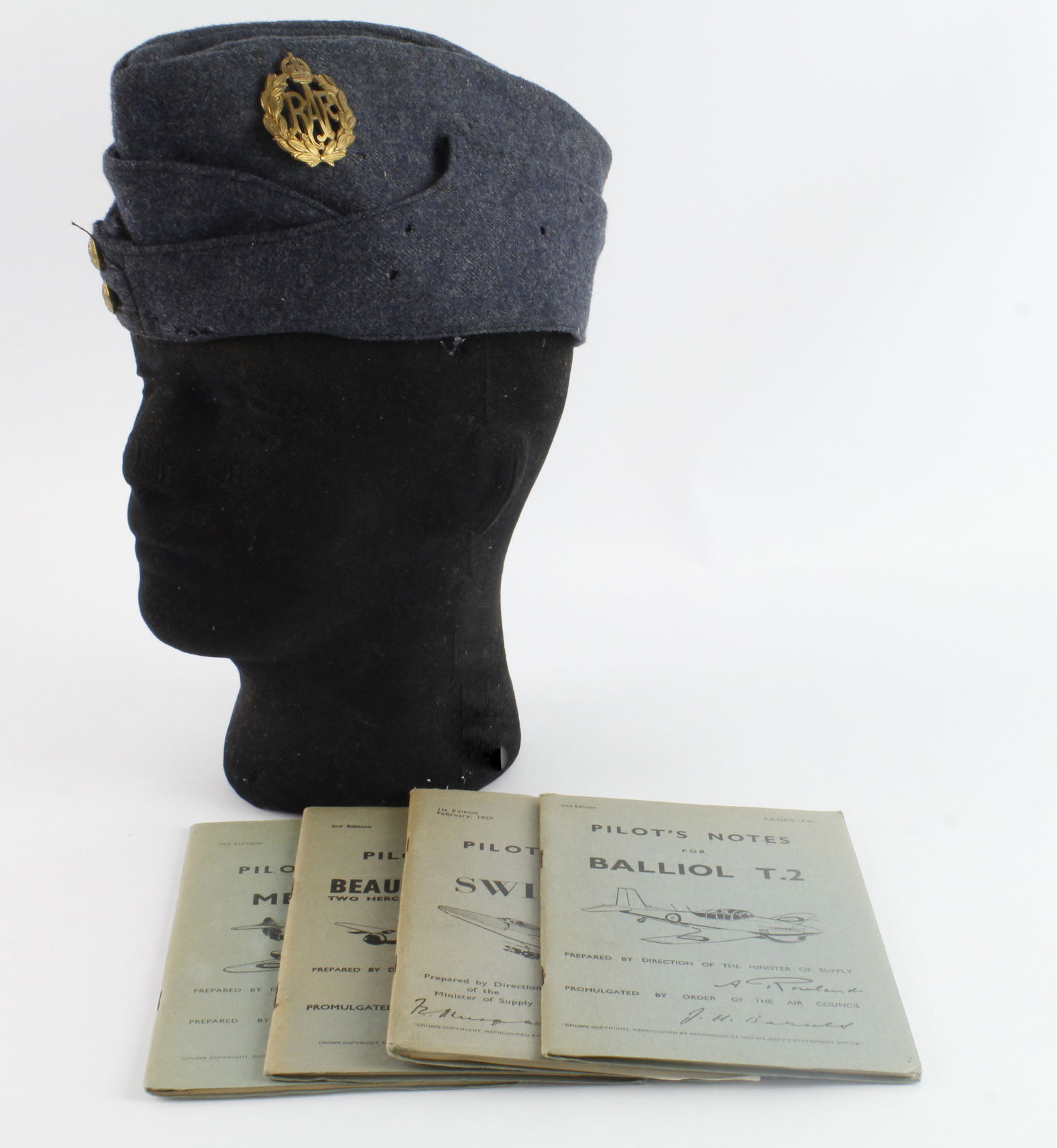 RAF airman’s side hat with pilots note books on the Swift F.7, Beaufighter TFX, Balliol T.2,