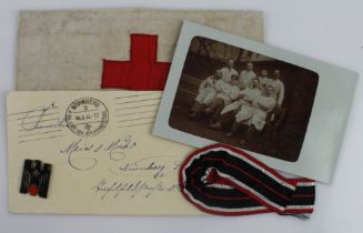 German 3rd Reich DRK lot: SS stamped medical armband, photo, letter, badge