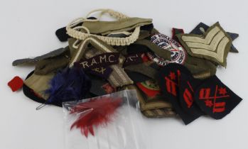 Badges collection of military cloth including rank stripes, epaulets etc.