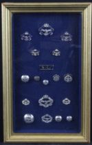 Northern Rhodesian glazed & framed collection of QE2 era badges and buttons, including chromed and