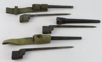 British Spike bayonets (3) in their scabbards. Two with M.E.Co frogs + one plastic scabbard. All GC