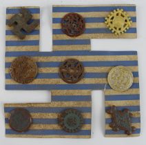 German 3rd Reich Archaeology Winterhilf Tinnie Badges on the original Swastika card. The badges