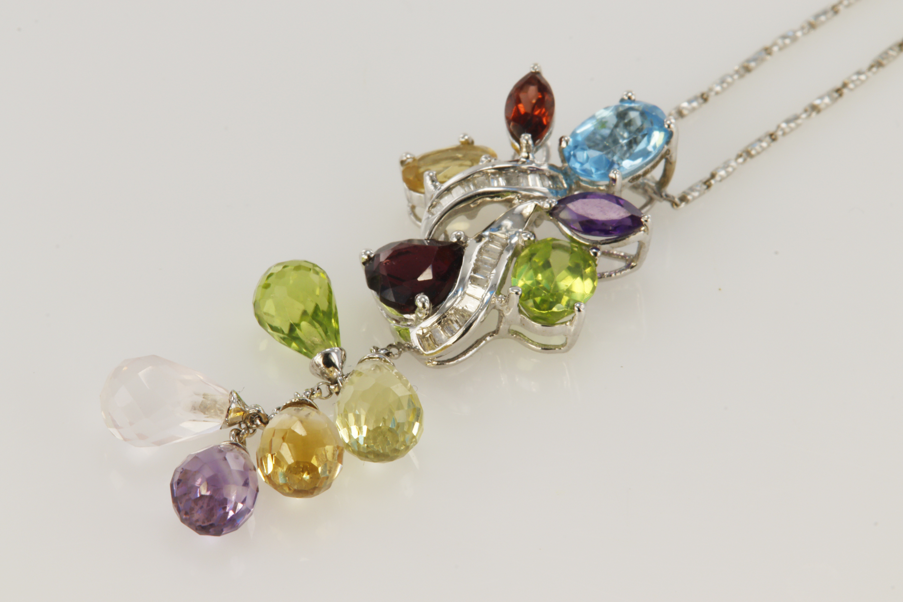 18ct white gold pendant and chain featuring multi semi precious gemstones of differing cuts/shapes