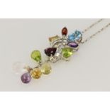18ct white gold pendant and chain featuring multi semi precious gemstones of differing cuts/shapes