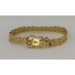 Yellow gold (tests 18ct) diamond buckle bracelet, buckle clasp set with round brilliant cut