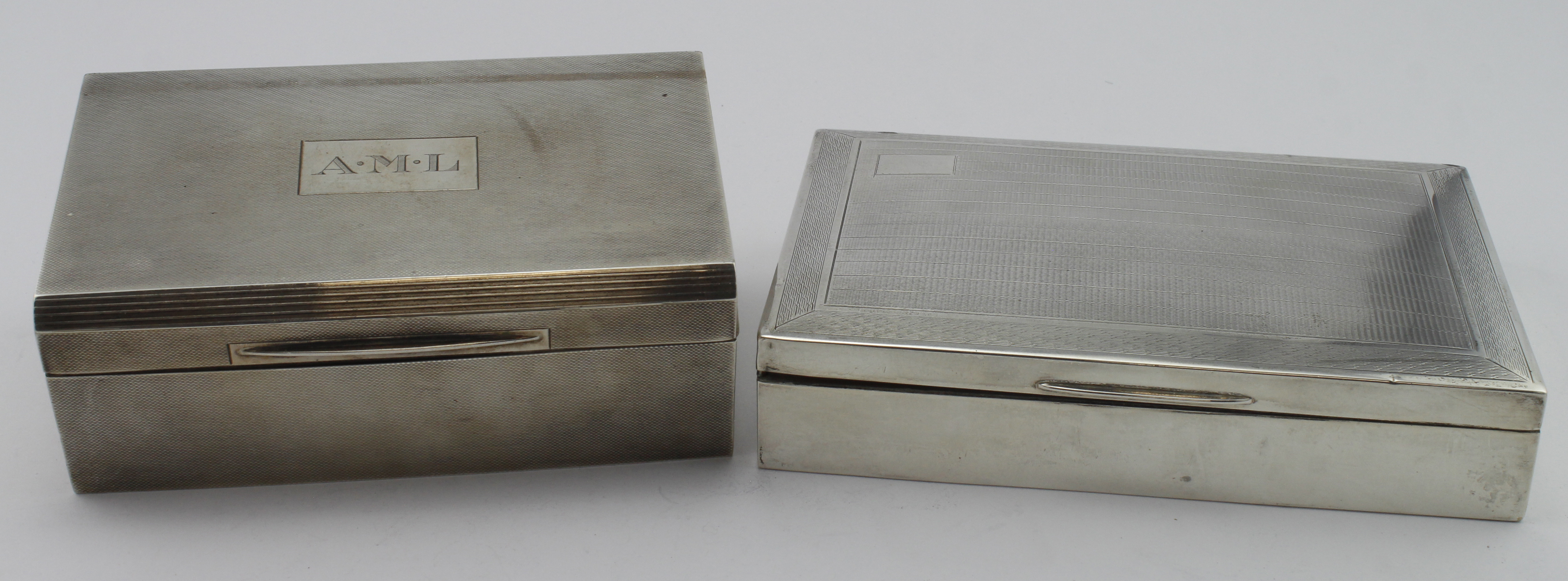 Two silver cigarette boxes, the small one presented by the Perak Turf Club at the Amateur 1959