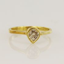 18ct yellow gold diamond cluster ring, set with nine calibre cut diamonds, head measures 7 x 6mm,