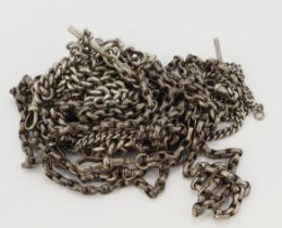 Assortment of silver/ white metal chains, four pocket watch chains and one muff chain, lengths