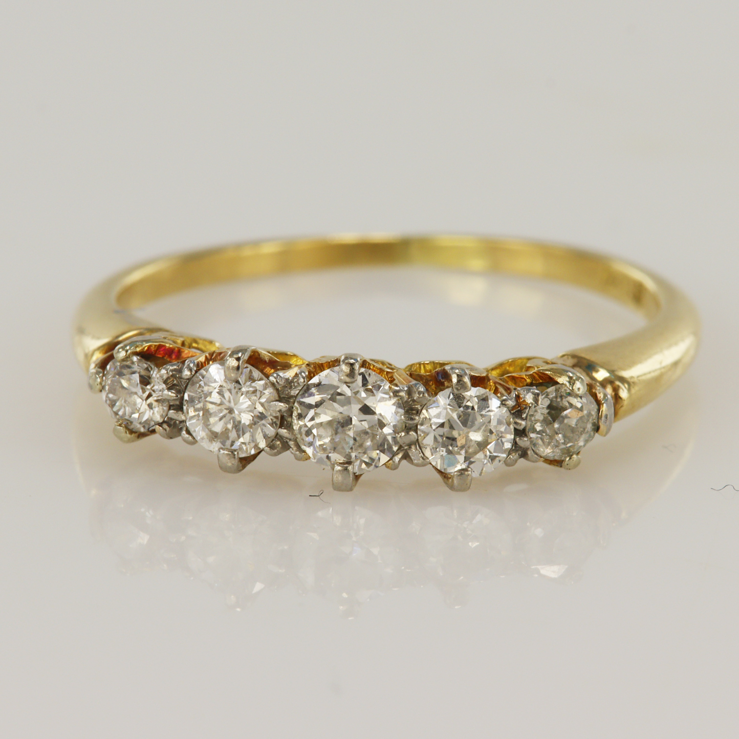Yellow gold (tests 18ct) vintage diamond ring, five graduating old cut diamonds, TDW approx. 0.45ct,
