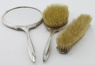 Three piece yellow guilloche enamel & silver dressing table set comprising a hand mirror, hair brush