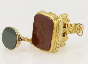 Two 9ct yellow gold pocket watch fob/pendants, stones include bloodstone and a cornelian intaglio,