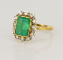 18ct yellow gold diamond and emerald cluster ring, one step cut emerald approx. 3ct, measuring 9