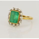 18ct yellow gold diamond and emerald cluster ring, one step cut emerald approx. 3ct, measuring 9