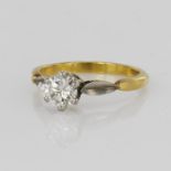 18ct yellow gold and platinum solitaire ring featuring a round brilliant cut diamond weighing