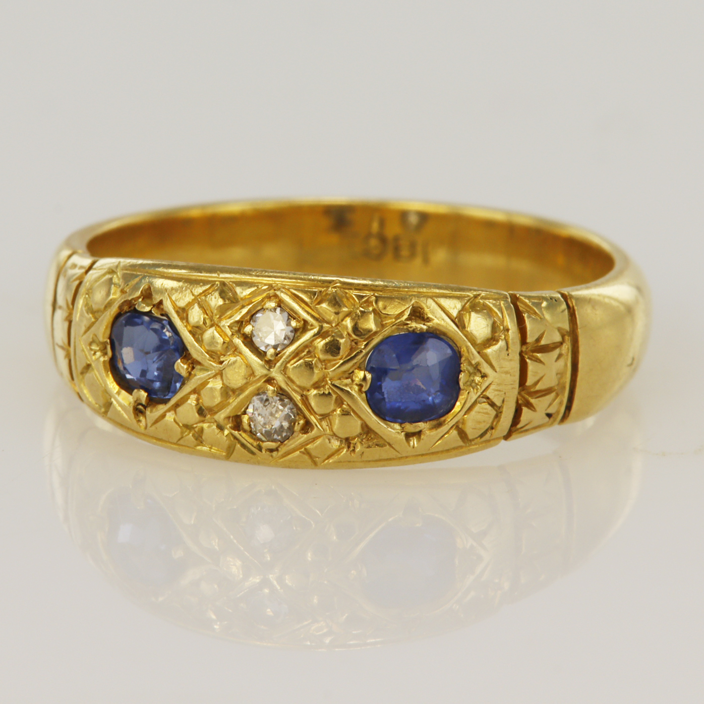 Yellow gold (tests 18ct) diamond and sapphire ring, two sapphires approx. 3mm each, two diamonds,