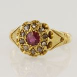 18ct yellow gold Edwardian diamond and ruby cluster ring, one round ruby measures 4mm, surrounded