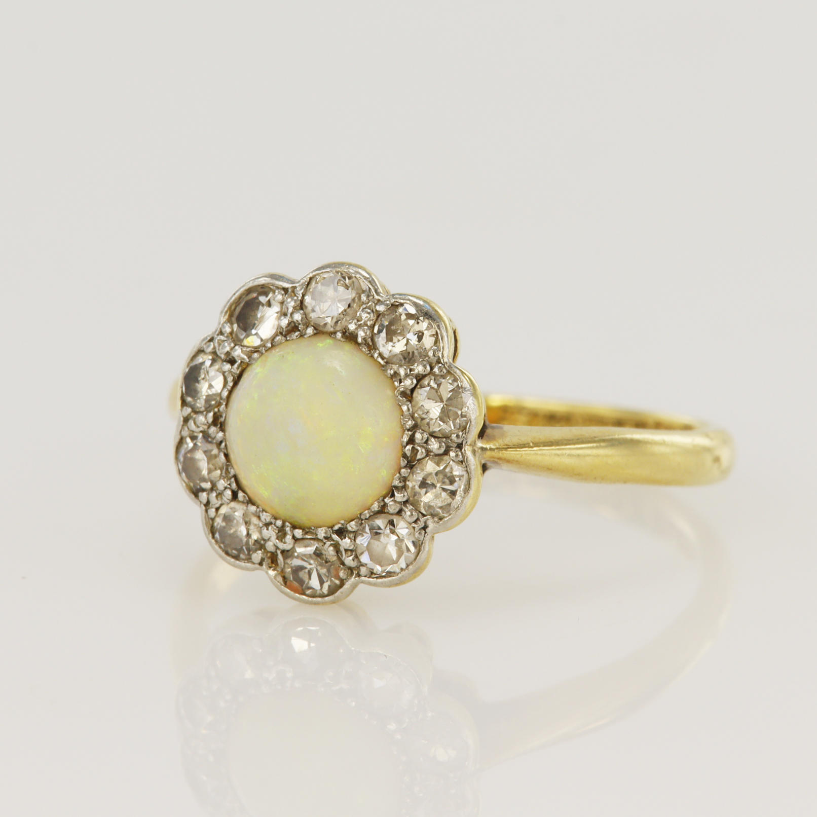 Yellow gold (tests 18ct) vintage diamond and opal cluster ring, one round cabochon opal measures 6.