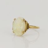 Yellow gold (tests 14ct) opal dress ring, oval cabochon opal measures 3.5 x 9mm, finger size L/M,