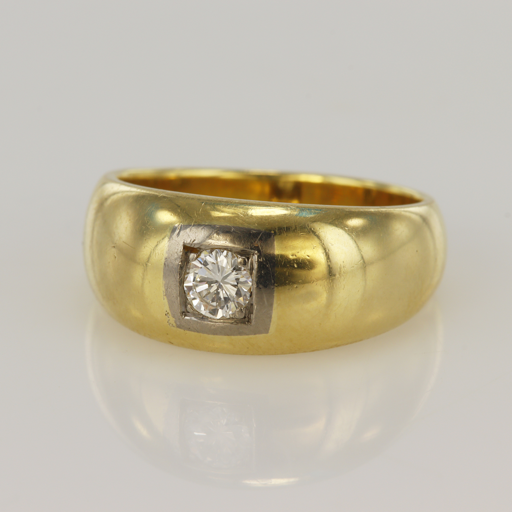 Yellow gold (tests 14ct) diamond gypsy ring, one round brilliant approx. 0.28ct, setting highlighted