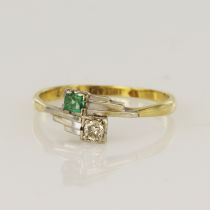 Yellow gold (tests 18ct) vintage diamond and emerald Toi Et Moi ring, one old European cut approx.