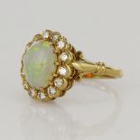 18ct yellow gold opal and diamond cluster ring, one oval cabochon opal measures 11 x 8.5mm,