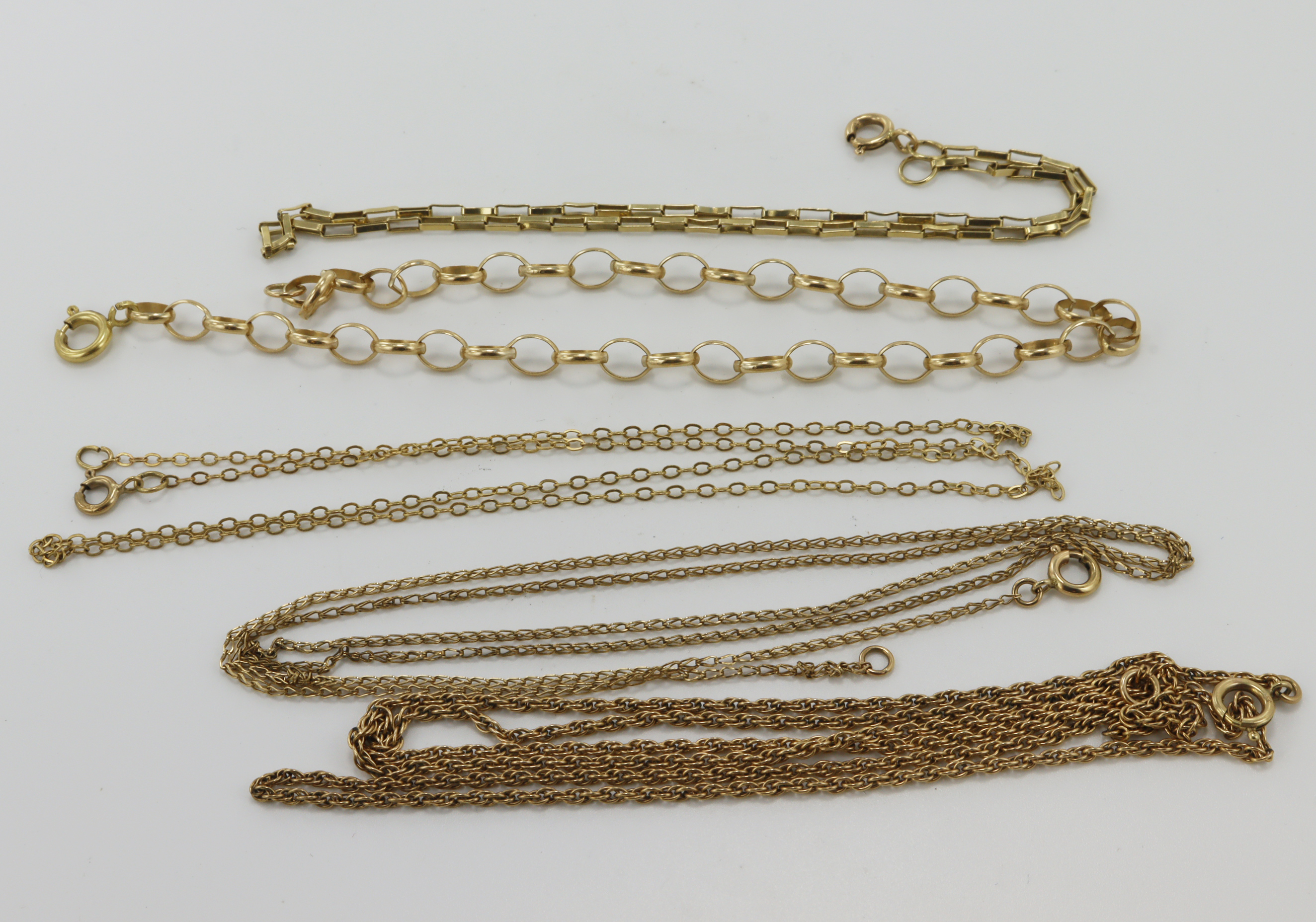 Five yellow gold (tests 9ct) chains, lengths 9", 10.5", 18", 24", 23", total weight 13.2g.