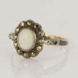 9ct yellow gold and silver cluster ring set with a central oval opal measuring approx. 6.5mm x