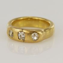 Yellow gold (tests 18ct) diamond gypsy ring, one old mine cut and two European cut diamonds, TDW