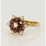 9ct yellow gold opal and ruby cluster ring, seven cabochon opals, six round rubies measuring