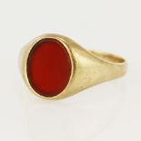 9ct yellow gold cornelian signet ring, oval table measures 12 x 9mm, finger size X/Y, weight 4.7g.