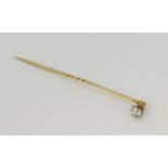 Yellow gold (tests 18ct) diamond solitaire stick pin, one old mine cut approx. 0.45ct, estimated