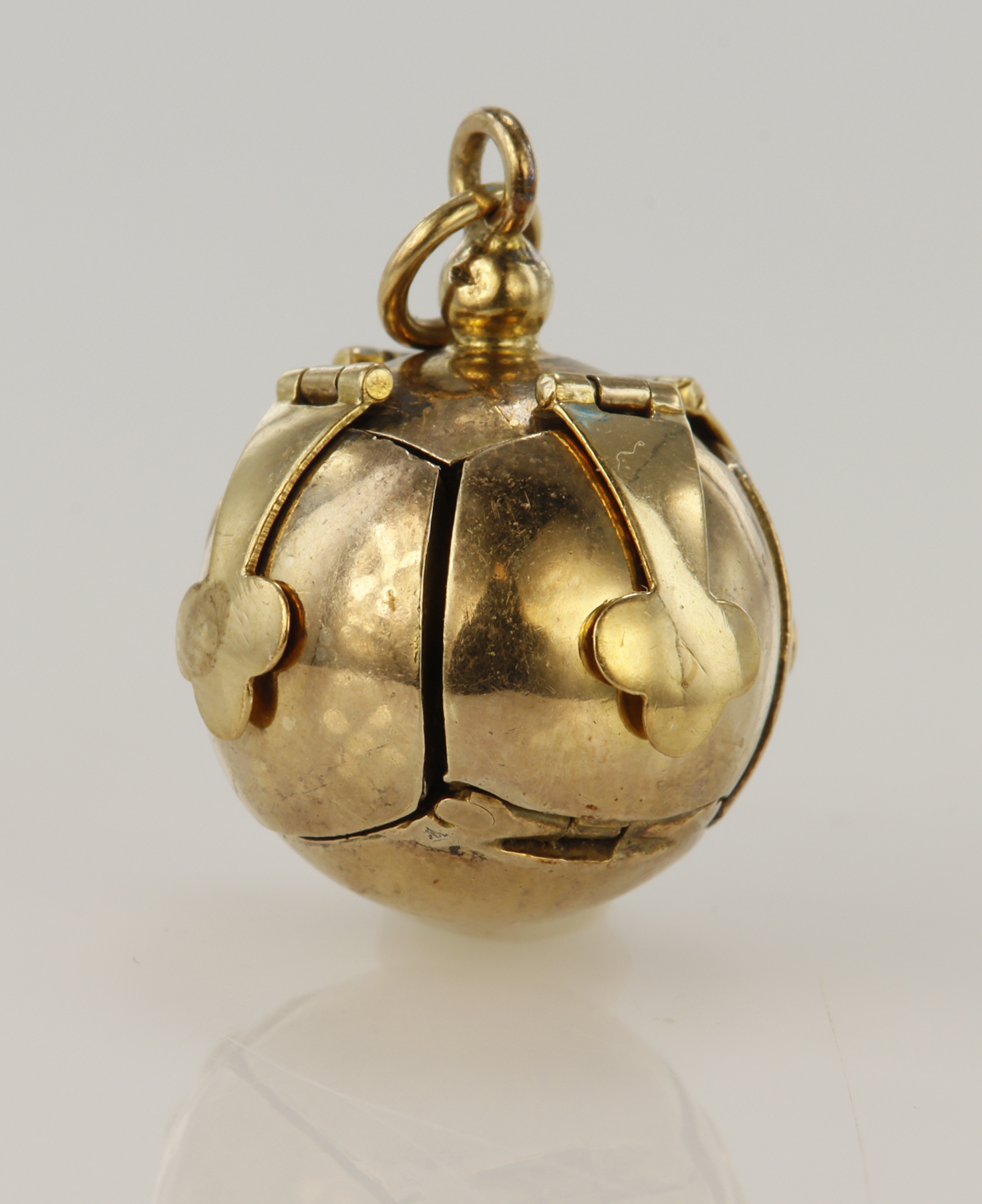 Gold on silver Masonic orb fob ball/cross pendant, weight 10.1g.