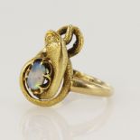 Yellow gold (tests 15ct) opal serpent ring, oval cabochon opal measures 6 x 4mm, coiled snake body