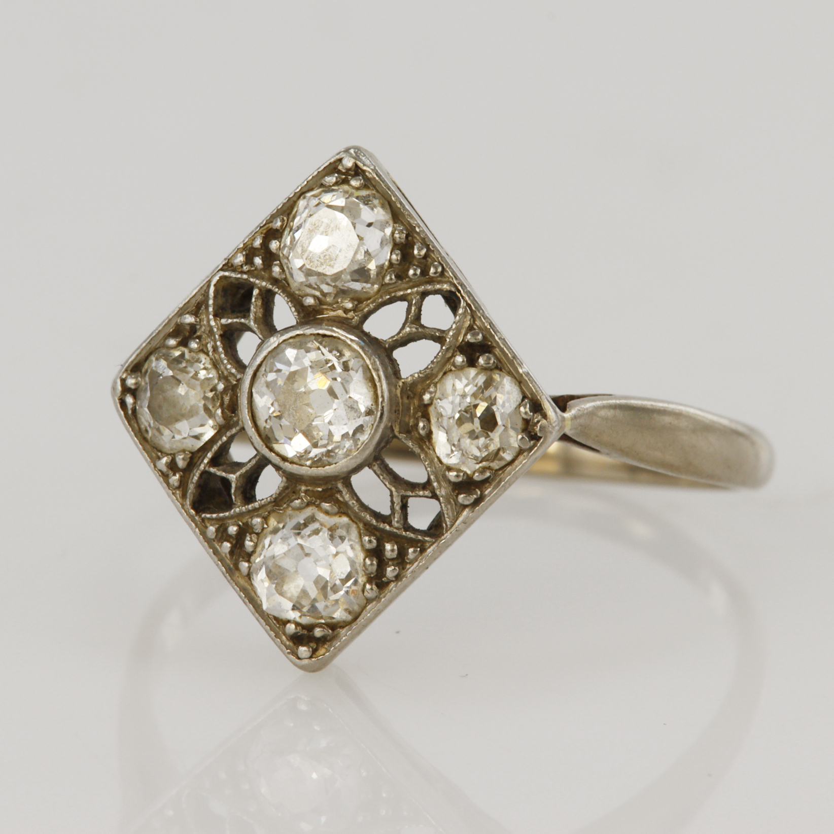 White gold (tests 18ct) vintage diamond cluster ring, five old cut diamonds TDW approx. 0.80ct, head