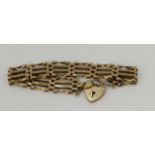 9ct yellow gold four bar gate bracelet with heart padlock, length approx. 7", width 13mm, weight