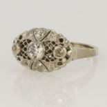 Tested as platinum Art Deco style dress ring with central round old cut diamond weighing approx. 0.
