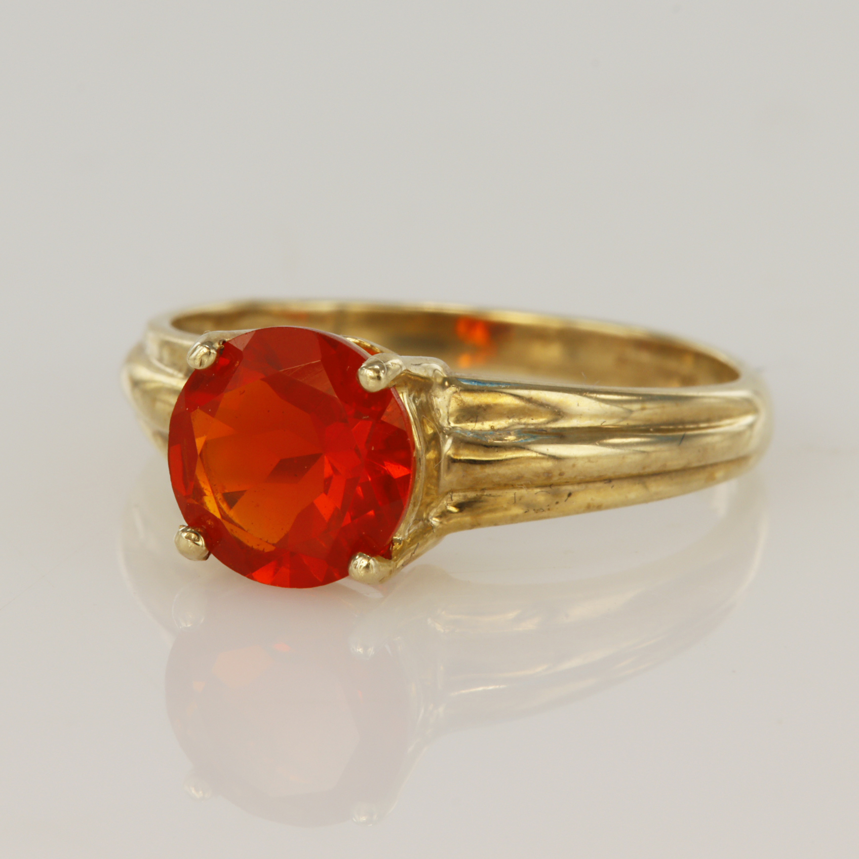 9ct yellow gold fire opal dress ring, one round faceted fire opal measuring 8mm, finger size P,