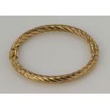 9ct yellow gold rope hinged bangle, width 6mm, inside diameter 59 x 53mm, sprung hinged fitting,