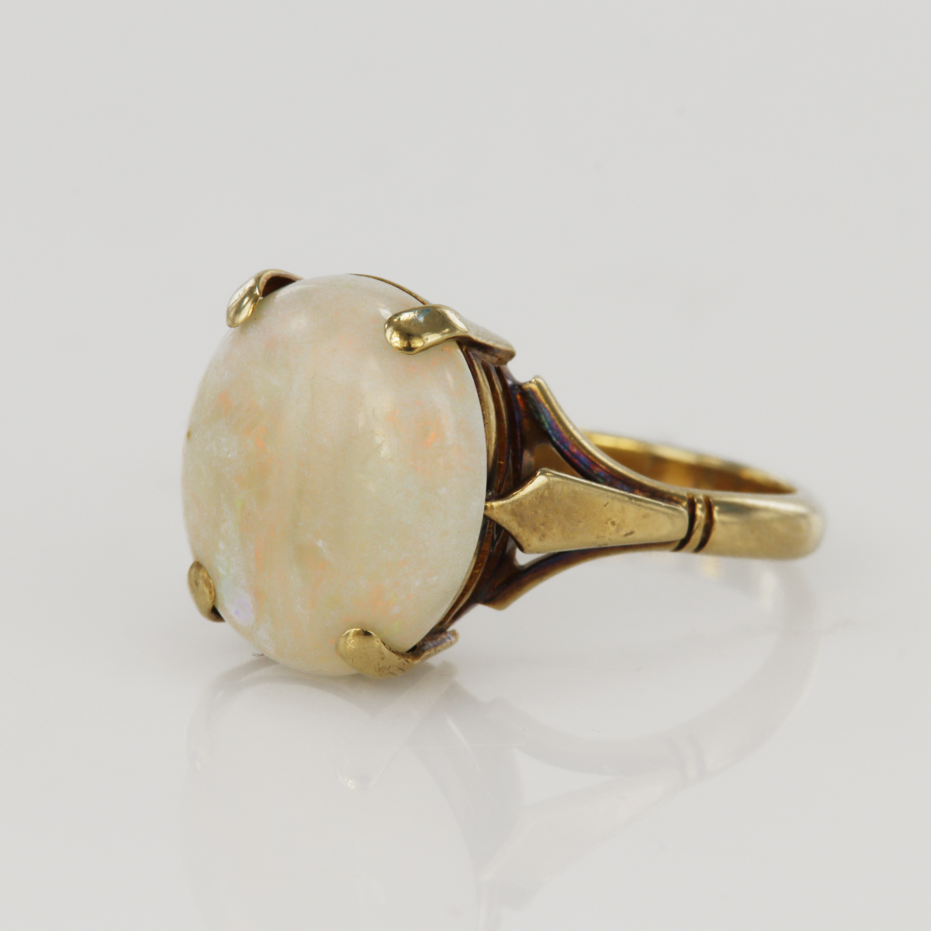 Yellow gold (tests 9ct) opal cocktail ring, opal measures 12.8 x 11mm, finger size L/M, weight 3.