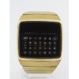 Gents gold plated Hewlett Packard HP-01 calculator watch, circa 1970s. The black calculator front