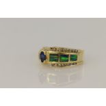 Yellow gold (tests 14ct) diamond, tanzanite and black opal ring, oval tanzanite measures 5 x 3mm,