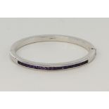 9ct white gold amethyst bangle, twenty square cut amethysts measure approx. 3mm, hinged with box