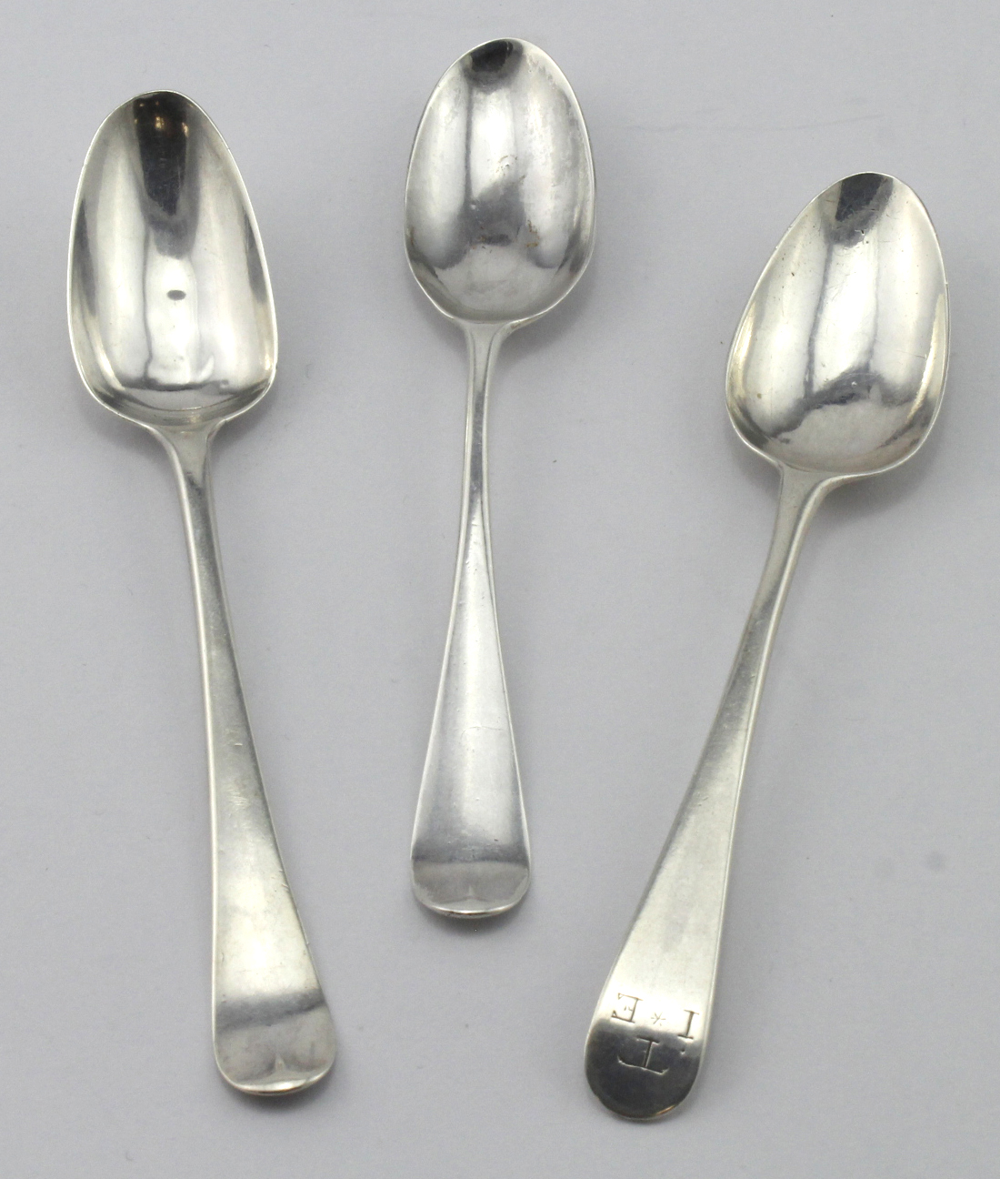 Mixed lot of three picture-back silver teaspoons comprising two Hanoverian pattern c1760 (Dove &