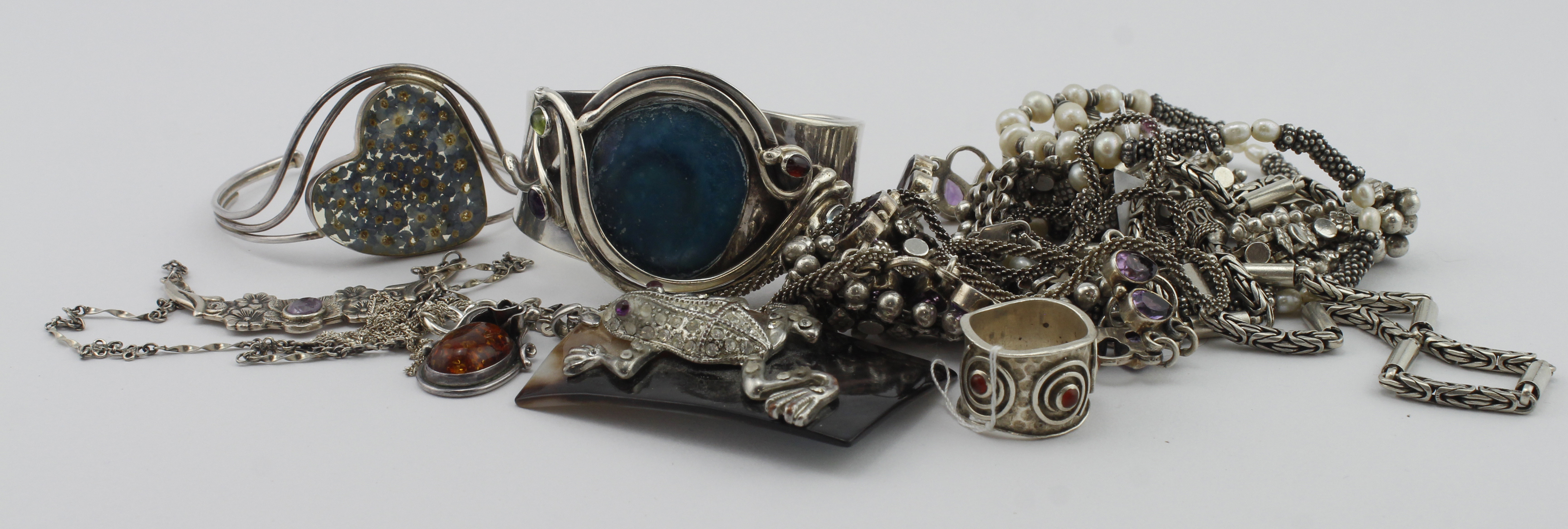 Assortment of silver/tests silver jewellery, stones include amethyst, cornelian, amber, mother of