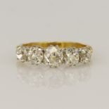 18ct yellow gold antique diamond dress ring, five graduating old mine cuts principle approx. 0.95ct,